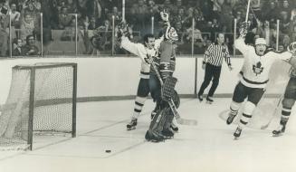 Leafs cheer their tying goal. Montreal Canadians goalie Ken Dryden is forlon figure in middle as Leafs' Dave Keon (left) and Inge Hammarstrom raise ar(...)