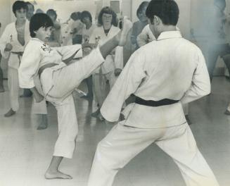 Chin Up. 4th dan black belt karate expert Tadayoshi masuko doesn't lead with his chin when he faces 13-year-old Kathy Uberti. She's been taking classe(...)