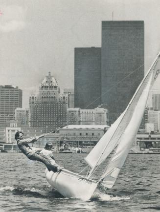 A perfect day for sailing, With a stiff breeze ruffling the sparkling waters of Toronto Harbor yesterday, Billy Ellis does a balancing act on Royal Ca(...)
