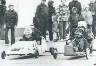 Grand Prix form is shown by Shawn McClelland (left) and Peter Higgins during their heat in Canadian Soapbox Racing Association's derby on Sparks Ave. (...)