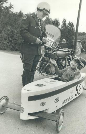 Constable Ron Henderson pretends to give Kevin McClelland a ticket