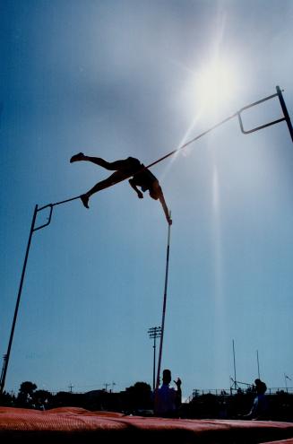 Pole vault champ Jeff Miller attempts to clear five metres (16