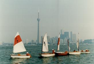Right, children participating in the Island Yacht Club's four-week sailing school play follow the leader in Toronto harbor