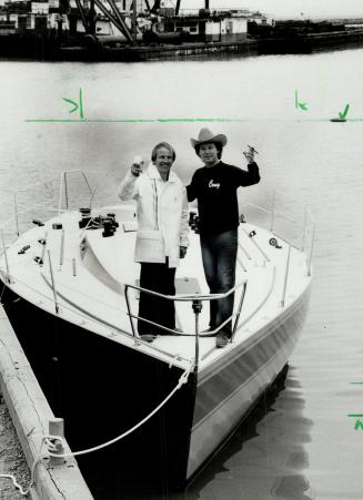 Smooth sailing: Builder Andy Wiggers (left) and owner Tony Ronza tast the launch of the Coug, to be Ronza's entry in the Canada's Cup, in Oshawa harbor recently