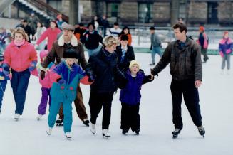 Bobbie Henley and Tom Hodgson take a spin at Nathan Phillips Square with their children, Jacqueline, 9, and Ryan, 7