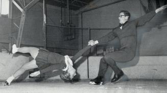 Chris and Alexis Shields demonstrate one of pairs skating's classic manoeuvres--the Death spiral