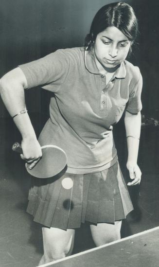 Rupa Banerjee, backhand smash in a workout at the Toronto Table Tennis Club
