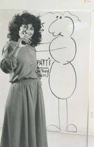 Patti Stren at work on squiggly figure, lettering