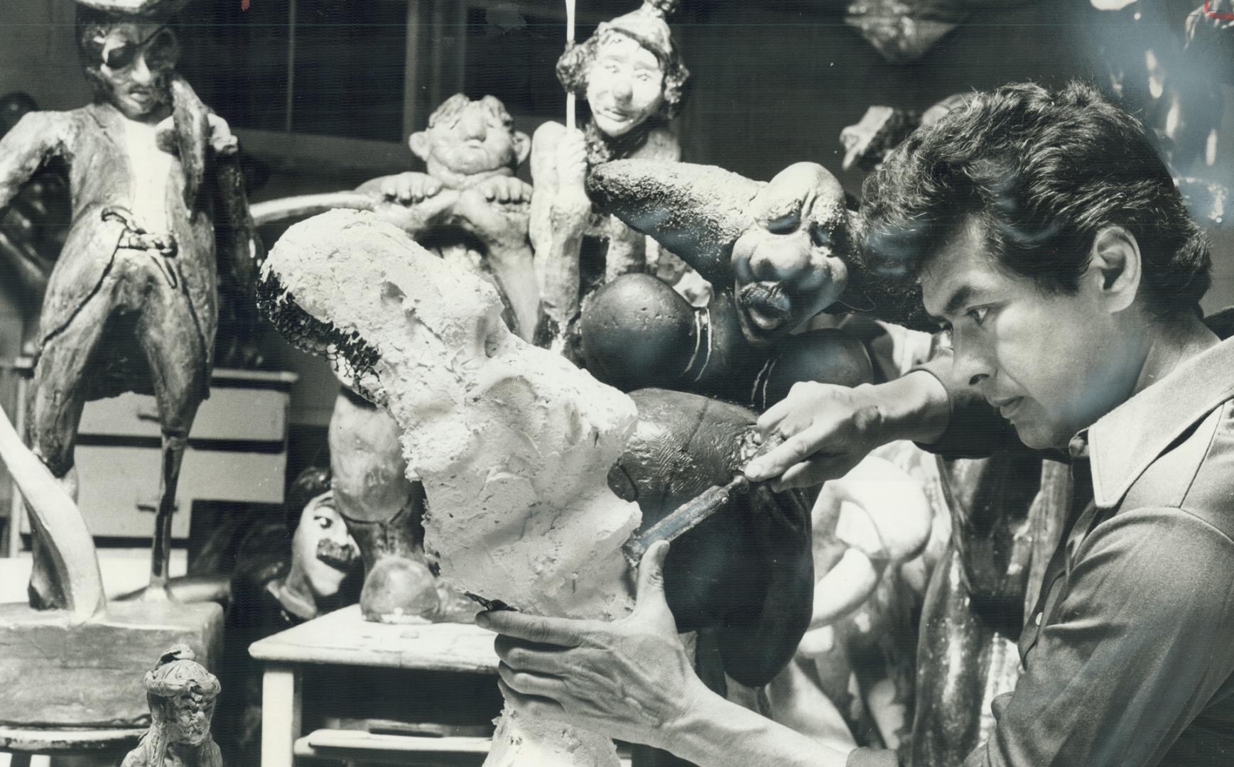 Agincourt Artist Don Chase works on one of his many sculptures in the basement at his home