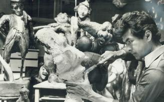 Agincourt Artist Don Chase works on one of his many sculptures in the basement at his home