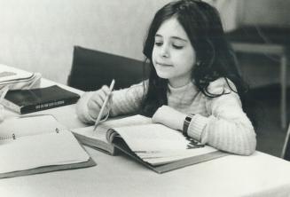 April Lerman tackles her schoolwork