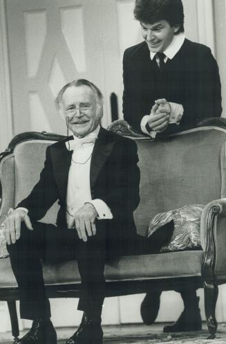 Creaking vehicle: Sir John Mills (seated), stars as chief magistrate Posket and Dominic Guard is his son, Cis, in Little Lies, which opened last night at the Royal Alex