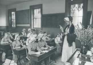 Education In Metro Takes A Long Leap Backward, Marion Peart, dressed as a teacher might have in 1861 teaches her Grade 5 class of children from Etobic(...)