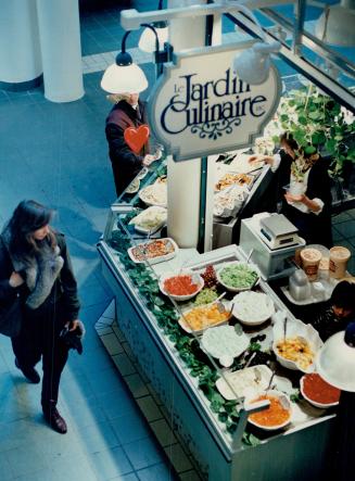 on the main floor, inventive take-home salads are displayed at Le Jardin Culinaire, one of dozens of specialty food booths