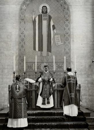 During the communion service, monks are seen in elaborate robes, the one luxury they permit themselves
