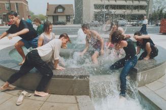 Wild and wonderful, wacky and wet, Wringing wet from a involuntary bath in the fountain and waterfall in Mel Lastman Square, a group of Grade 12 stude(...)