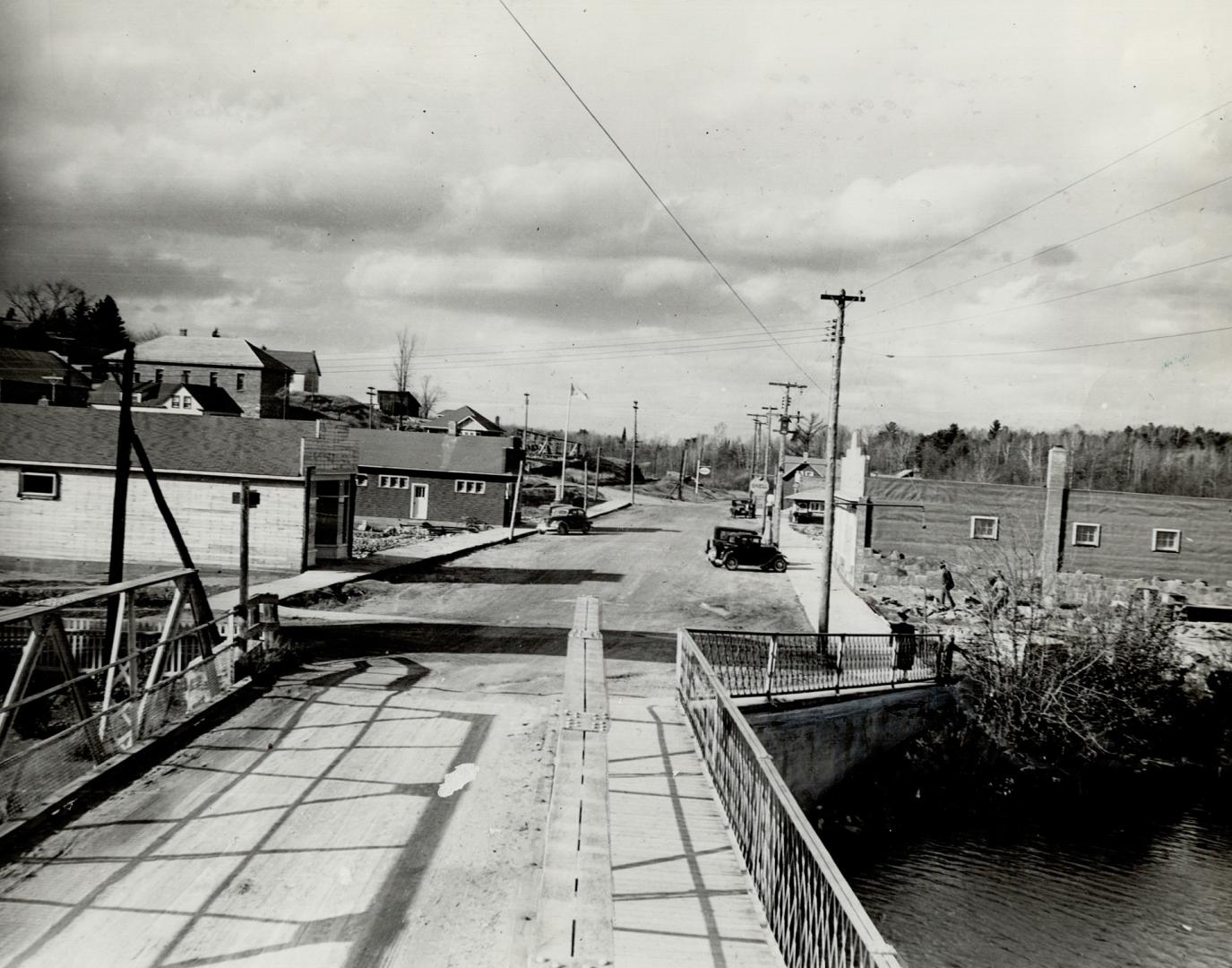 At left is the town as it stands today with most of the buildings reconstructed