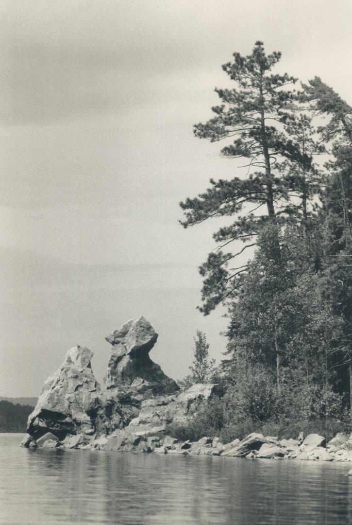 A sacred Conjuring Rock broods over the as yet unspoiled tranquility of Obabika Lake in the Temagami region