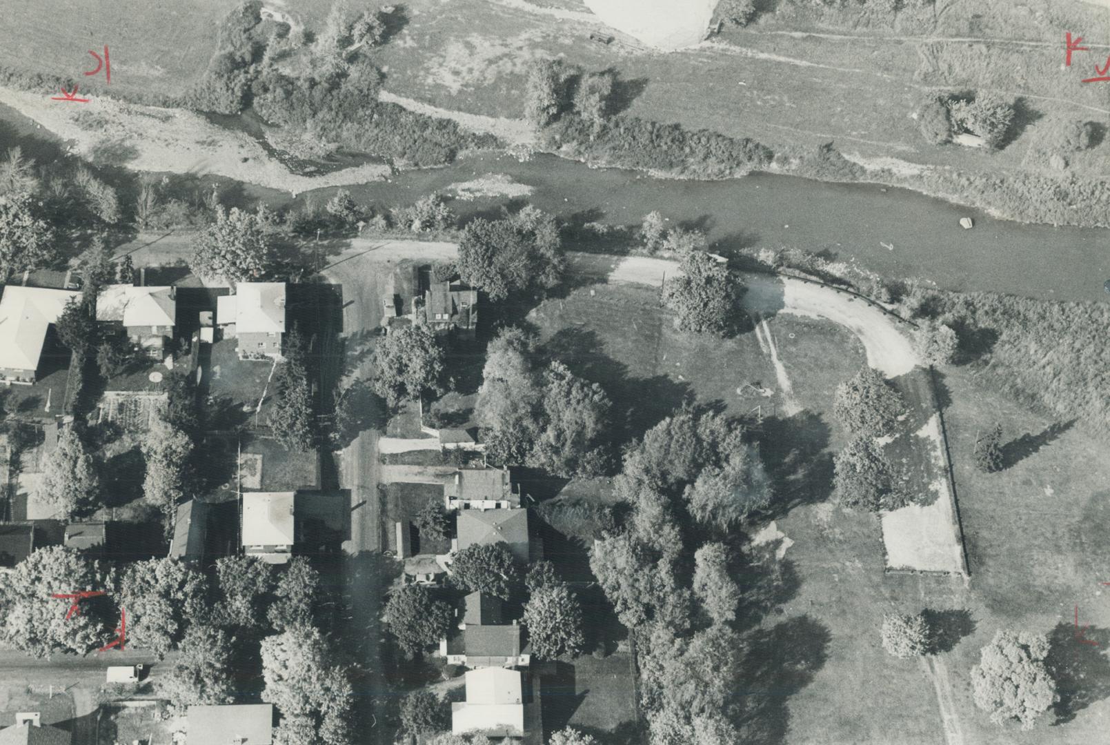 The placid humber river running along the lower part of Raymore Dr. in this aerial photo was a demon unleashed on the night of Oct. 15, 20 years ago t(...)