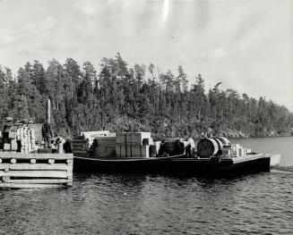 Supply scow on dock at Steep Rock Lake