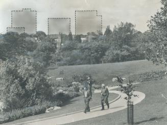 Image shows a few gentlemen walking in the park with contours of the high-rise apartment buildi ...