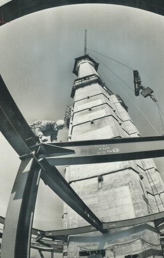 Workman erects steel framework for CN Tower restaurant