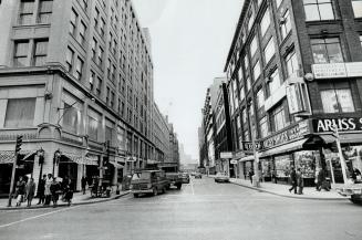 Before: Albert St. looking west from Yonge, now has Eaton's main store on south side, shops and more Eaton's buildings on the north. First phase of Ea(...)