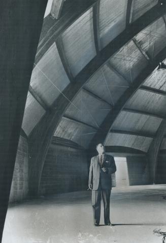 Rev. A. W. Ness, Looks over interior of his cathedral