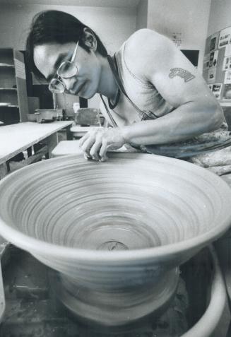 In-town courses in metal arts and ceramics are being offered at George Brown College's Casa Loma Campus, where Jimmy Louie works on a pot. Other cours(...)