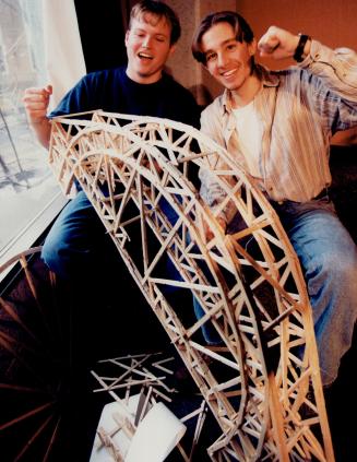 Stick-ing to bridge building, Architecture and engineering students at Ryerson Polytechnic University raise Popsicle stick bridges yesterday in annual contest