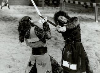 Serious business, Pat Lamke, right, and Leland Burbank battle it out in a Medieval Times Dinner and Tournament (Toronto) Inc. sword fight