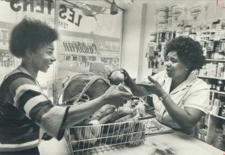 Jamaican specialities bring Clara Lemontagne, 24, left, to shop at store run by Florrie Temple