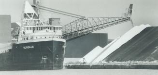 Image shows unloading in progress from a cargo ship.