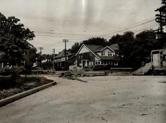 Home of Mrs. R.S. Pentecost on N.E. corner Clifton Rd. and Inglewood Drive, showing how angle at which the new highway in foreground enters Clifton Rd(...)