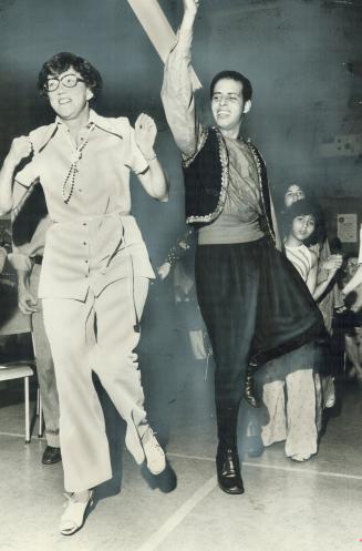 Learning a new step. At Baghdad, a Caravan '75 pavilion on Cosburn Ave. in East York, Margaret Preston learns the dabke, an Arabian ballroom dance, fr(...)
