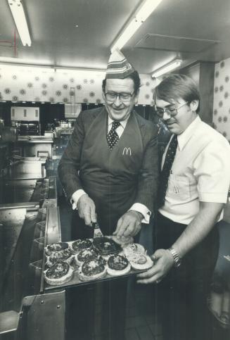 Hugh Carter gets Big Mac cooking lesson from McDonald's manager Paul Tuma