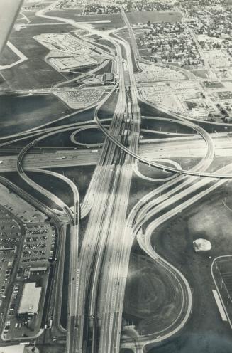 Up in air: That picture of the Spadina expressway interchange with Highway 401 doesn't show the fumes and frayed tempers of rush-hour as cars head downtown