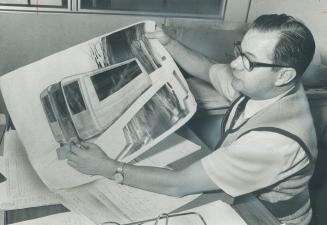 Project manager Clifford Ditchfield shows the driverless cars proposed for Metro by Hawker Siddeley Canada Ltd