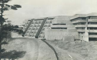 Scarboro College is fortress-like school which hugs the rim of highland creek and is built entirely of poured concrete