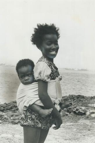 Senegalese children play happily on the island of Goree, off the mouth of Dakar harbor, unaware and uncaring that this was the major terminus of the slave trade