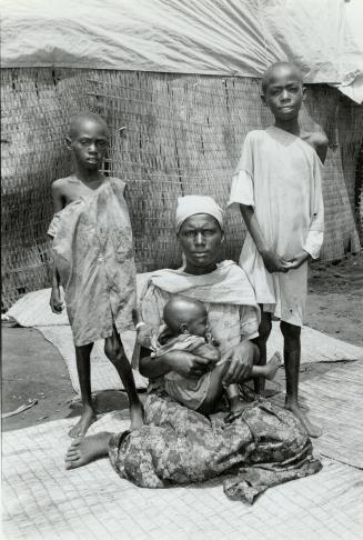 Fleeing war: Refugee Ndabihorere Munezero, with her 9-month-old daughter Bukensenge and sons Sibomana, left, and Hakizimana
