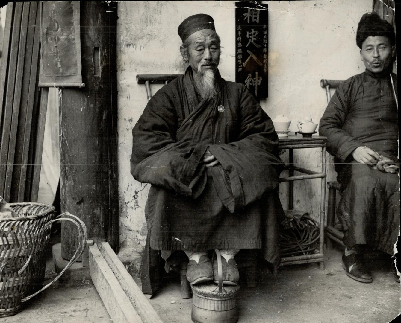 Picturesque in his primitive way of life is this Chinese patriarch, who suffers the privations of a protracted war with a philosophical silence. [Incomplete]