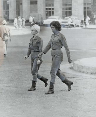 Typical Havana street scene includes girls in trim uniforms
