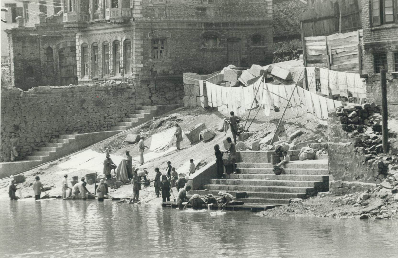 Doing the laundry in the river Jhelum is a rough and ready operation