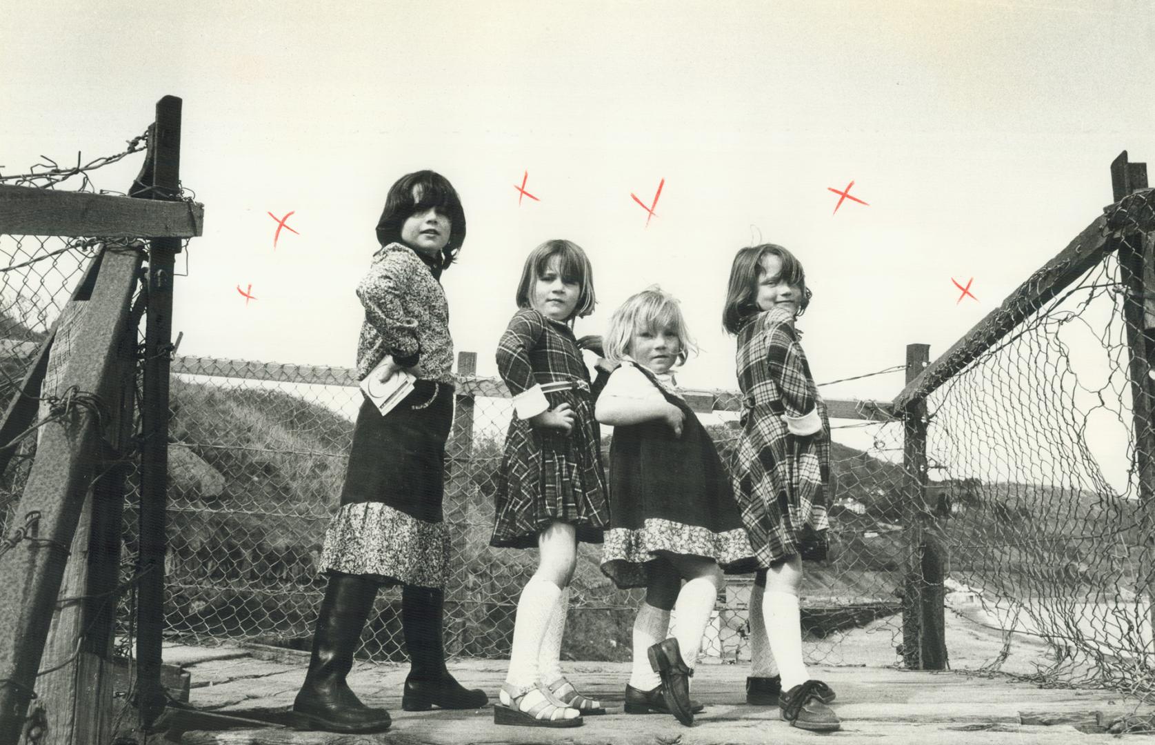Clowning children on a beach near Killiney mimic fashion models they see on television