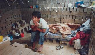 Cholera Peru - A man in his brick hut he built 4 days ago