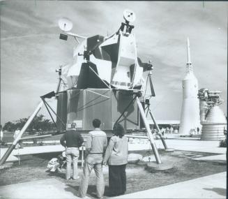 Lunar module draws the attention of these Kennedy visitors