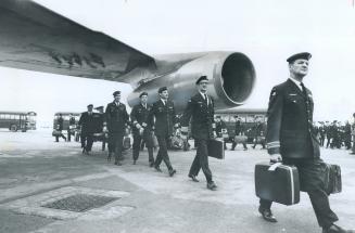 Military Members of the Canadian peace observation team head for their plane at Dorval Airport in Montreal during the weekend. Prof. Eayrs says Canadian force will be in for difficult times