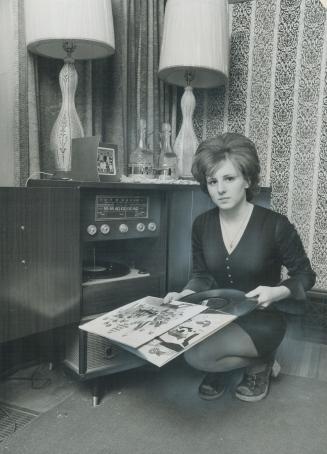 Acquitted of Non-Capital murder yesterday, Mary Evelyn Ament relaxes at home with a record