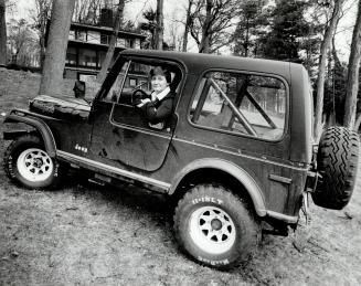 1980 Jeep. With orange racing stripes, owned by a 40-year-old woman